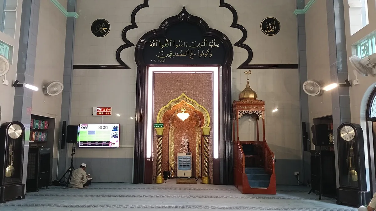 Muslim worshippers preparing for prayer inside the Malabar Mosque